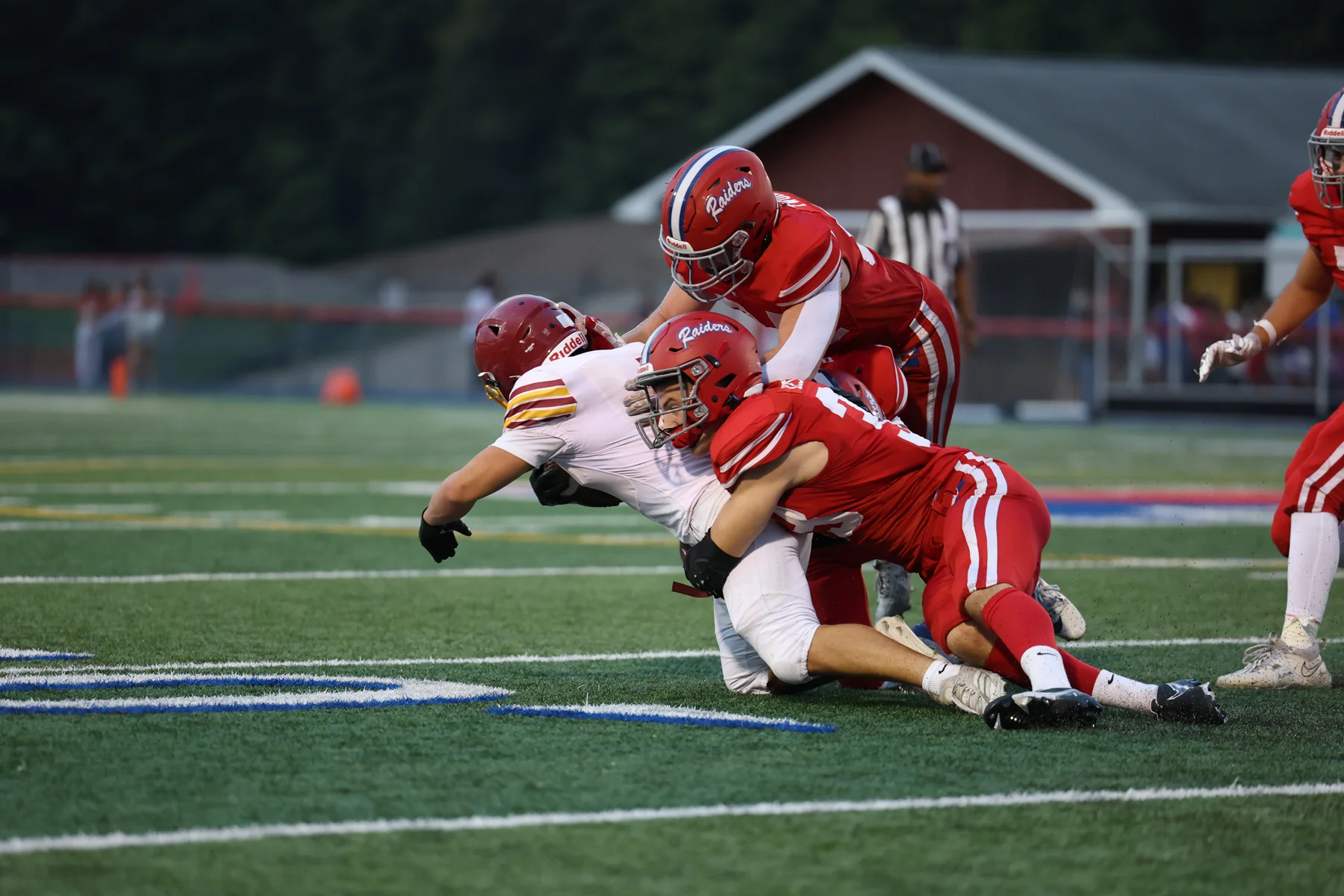 Defense making the tackle